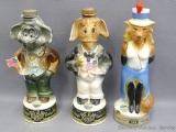 Three Beam decanters including elephant, donkey, and fox. Tallest measures approx 12