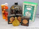 Two decanters including a gas pump and a 1804 silver dollar, more. Also includes Avon Indian Head