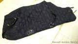 Black quilted horse blanket; seller says used once, small corner tear, in clean condition.