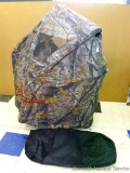 Portable single chair Realtree Hardwoods camouflage blind advertises Budweiser, King Of Beers.