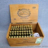 Sixty SPRG 30-06 rifle shells in a cigar box measuring approx 8