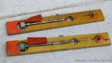 Two Arctic Fishermen wooden ice fishing tip-ups. Both appear in good shape.