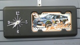 Battery operated Nascar clock promotes Dale Earnhardt. Dimensions are 21