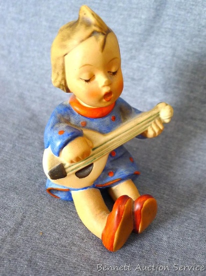 Hummel figurine - girl with mandolin, may be called 'Joyful' and is marked 'Germany'. Measures