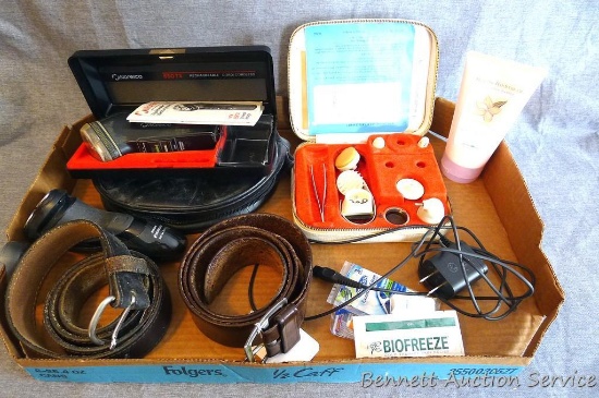Two leather belts; Two Norelco shavers; travel bag; accessory kit; more.