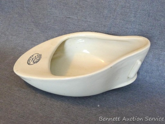 Smaller sized porcelain bed pan with patent date March 12, 1889. Measures 11-1/2" x 7" x 4" deep. No