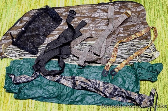 Camouflage soft gun cases, Stearns rain poncho, bow case (zipper doesn't work) and more.