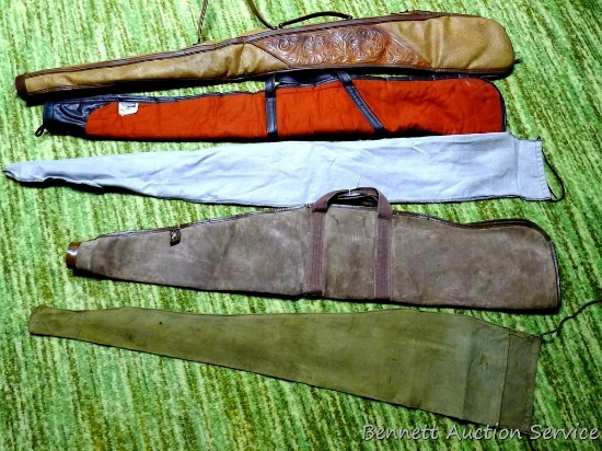 Assorted gun cases including two padded, two soft and one other. All show some wear.