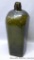Olive green bitters bottle with flower or cross pattern on the bottom. Dump dug bottle has some