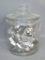 Glass cookie jar with vintage cookie cutters; jar is in good shape no chips or cracks, and measures