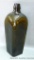 Olive green bitters bottle with flower or cross pattern on the bottom. Dump dug bottle has some