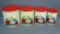 Four piece vintage nesting canister set depicts poppies, daisies and more. Largest stands 7