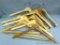 Ten sturdy wooden clothes hangers including one from J. Kadetski Custom Garment Makers of East