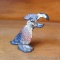 Little cast iron bird shaped bottle opener retains its original paint and stands 3-1/4
