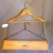 Two local advertising hangers. Wooden hanger advertises W.G. Woodward Co. Inc. of Park Falls, Wisc.