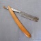 Antique straight razor with wooden handle is marked 'Erik Antun Berg Sweden'. 9-1/2