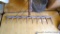 Antique wooden hay rake would make a spectacular coat rack in your entryway.