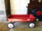 Classic Radio Flyer 90 wagon is in good condition with only a minor rust spot noted in bed. Bed