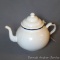 Wonderful enameled tea pot has a great shape. Stands approx. 7