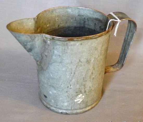 Heavy rustic galvanized pitcher stands 5" tall.