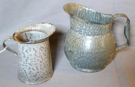 Two graniteware enameled pitchers. Larger is 6" tall, smaller is 4-3/4" tall.