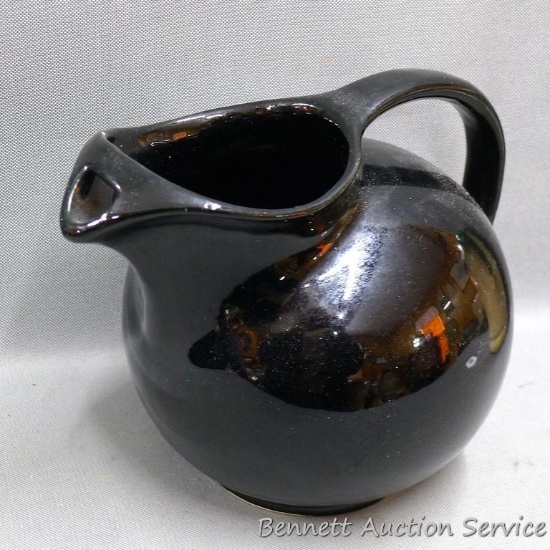 Black ball style pitcher is in nice shape with no chips or cracks, measures 7" x 8-1/2" x 7" tall.