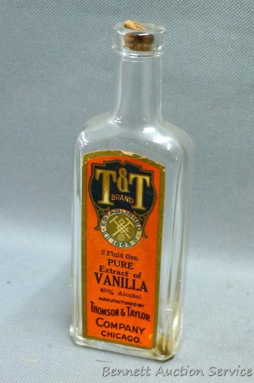 T&T Brand Pure Vanilla Extract bottle stands 5-1/2" tall. Bottle has great graphics and is in good