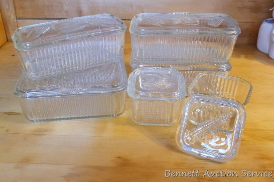 Vegetable pattern refrigerator dishes include six dishes with lids. Largest is an 8" square, others