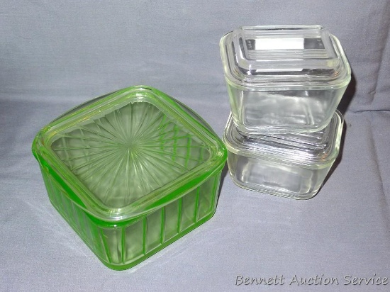 Two small covered Pyrex refrigerator dishes; green glass refrigerator dish. Pyrex dishes each