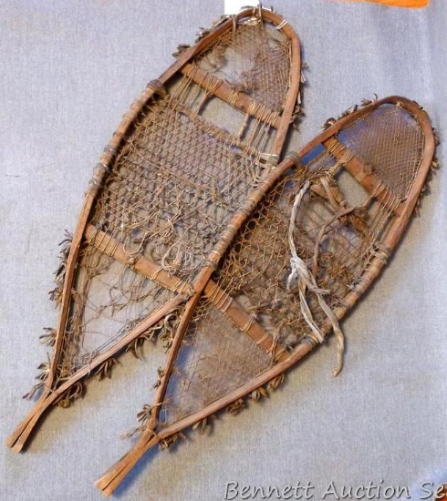 Antique handmade snowshoes measure approx 31"x 9-1/2". One binding is missing but would still make a