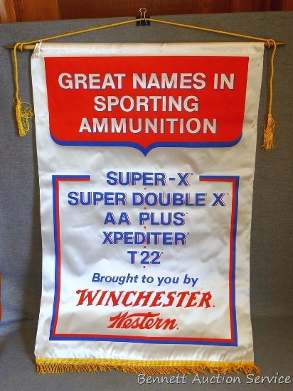 Winchester Western store banner is approx 33"x 22". In very good condition.