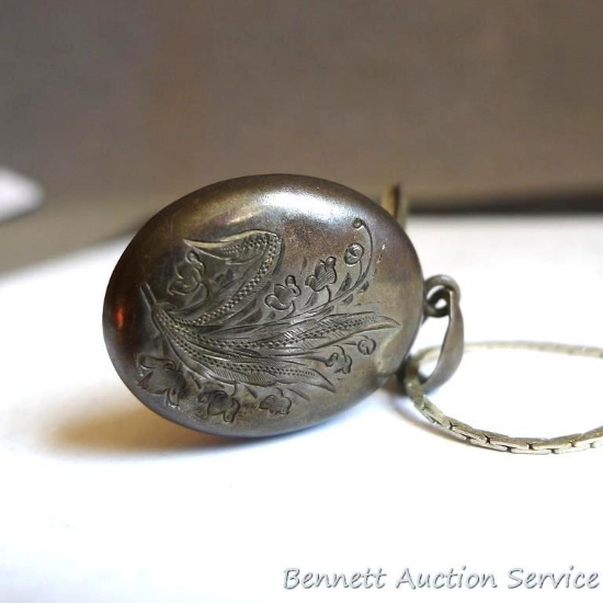 Antique locket with a window-door measures 1-3/4". On a newer chain, measures 10-1/4" long overall.