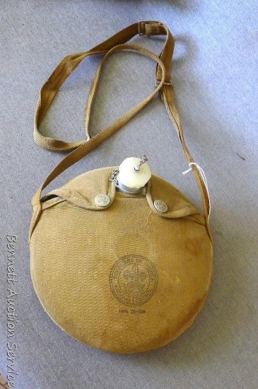 Vintage Boy Scout canteen with cotton cover and strap. Measures 8" across.