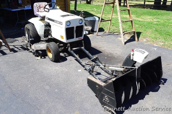 FMC Bolens Model QT16 lawn tractor with 48" triple blade mowing deck and 42" snow blower attachment.