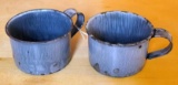 Two graniteware enameled cups. Each measure approx. 2-1/2
