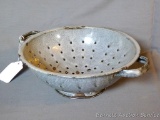 Gray enameled colander is in great shape for its age. Measures 12