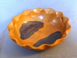 Wooden bowl has a nicely scalloped edge. Measures 14