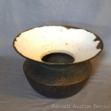 Nice old heavy cast iron spittoon has an enameled top. Measures 9-1/2