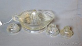 Ribbed glass juicer or reamer is in good condition; one Pyrex and two other glass percolator lids.