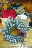 Box full and overflowing with better quality Christmas and winter decorations. Heap stands two feet