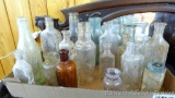 No Shipping. Collection of various sizes and shapes of vintage bottles; tallest bottle measures