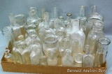 No Shipping. Collection of small and medium sized clear bottles; smallest jar is 2-1/2