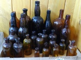 No Shipping. Brown and amber bottles in various sizes from small to large; tallest bottle is 12