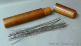 I believe these are tatting needles for lace making stored in a wooden case. Needles are about 9