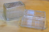 Two glass one pound butter dishes are in good condition overall with only one small chip noted on
