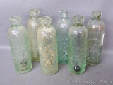 Six heavy antique bottles all marked 'Park Falls Bottling Works, Park Falls, Wis.'. Each bottle is