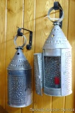 Two punched tin candle lanterns. One is approx. 15