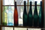 Nice collection of seven pretty wine bottles, up to 14