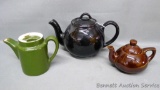 Largest of three teapots is heavier than it looks and is marked 'Lipton Tea' on the bottom. Smaller