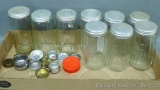 Eight piece spice jar set, plus one other and a bunch of shaker caps. Eight jars each stand approx.